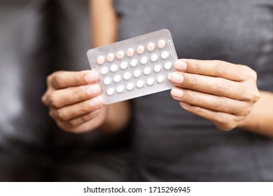 Woman Holding Combined Oral Contraceptive Pill.Gynecology Concept.