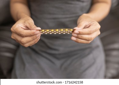 Woman Holding Combined Oral Contraceptive Pill.Gynecology Concept.