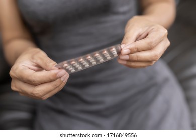 Woman Holding Combined Oral Contraceptive Pill.Gynecology Concept.