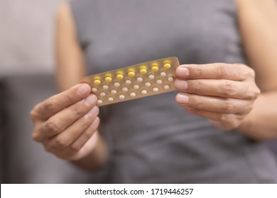 Woman Holding Combined Oral Contraceptive Pill.Gynecology Concept.