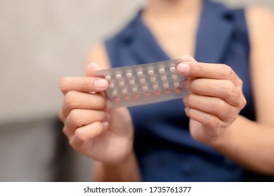 Woman Holding Combined Oral Contraceptive Pill.Gynecology Concept.