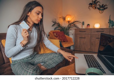 Woman holding credit card and shopping online. - Shutterstock ID 2017712228