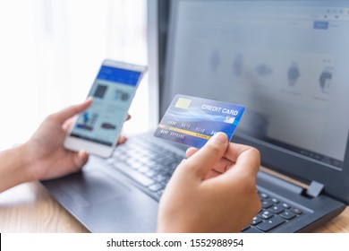 woman holding credit card and use laptop for with shopping online. Online payment concept. - Shutterstock ID 1552988954