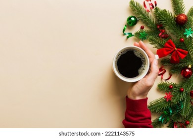 Woman holding cup of coffee. Woman hands holding a mug with hot coffee. Winter and Christmas time concept. - Shutterstock ID 2221143575