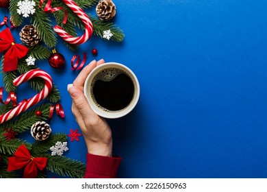 Woman holding cup of coffee. Woman hands holding a mug with hot coffee. Winter and Christmas time concept. - Shutterstock ID 2226150963