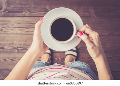 Woman Holding Cup Of Coffee. Top View