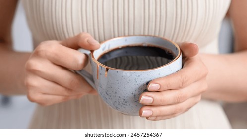 Woman holding cup of delicious coffee, closeup - Powered by Shutterstock