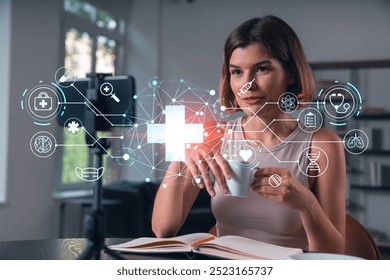 Woman holding a cup with futuristic medical icons overlay, sitting indoors. Concept of digital healthcare technology and innovation - Powered by Shutterstock