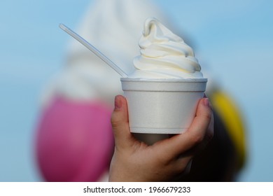 Woman Holding Cup With Tasty Frozen Yogurt Close Up Natural