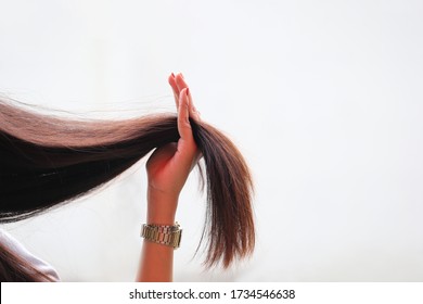 Woman Holding At Damaged Splitting Ends Of Hair, Haircare Concept