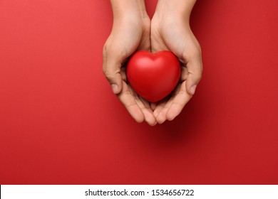 Woman holding decorative heart