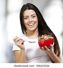 woman holding a delicious red breaksfast bowl, indoor