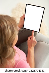 Woman holding digital tablet with empty white blank screen