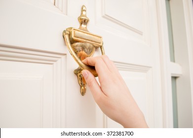 Woman Holding At The Door Using The Old Knock Door