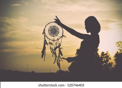 Woman Holding The Dream Catcher