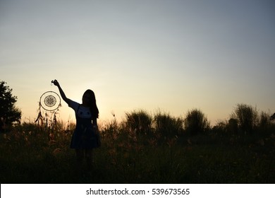 Woman Holding Dream Catcher