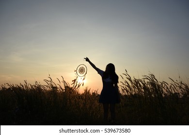 Woman Holding Dream Catcher