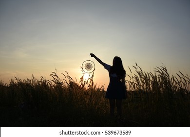 Woman Holding Dream Catcher