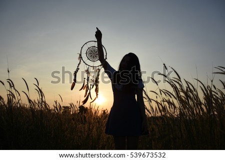 Woman holding dream catcher
