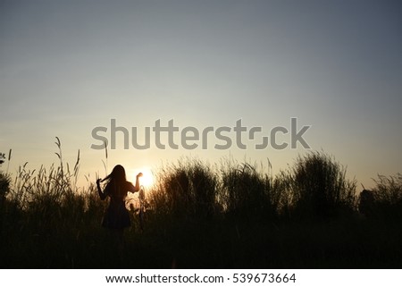 Similar – Image, Stock Photo Young woman looking at the sunset.