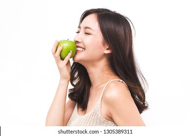 Woman holding and eating fresh green apple on white background.dieting concept.healthy lifestyle