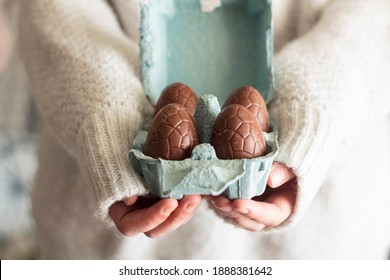 Woman Holding Egg Carton With Chocolate Eggs