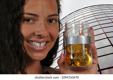 Woman holding the Electonic Currency known as Bitcoin - Powered by Shutterstock