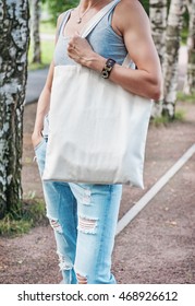 Woman Holding Empty Canvas Bag Outdoor. Template Mock Up