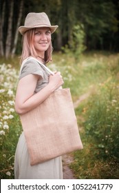 Woman Holding Empty Linen Bag Outdoor. Template Mock Up