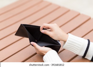 Woman Holding An Empty Wallet