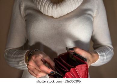 Woman Holding Empty Wallet At Night, Like Stealing Money