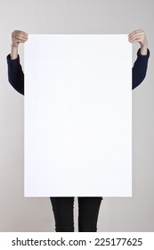 A Woman Holding A Empty(blank) White Paper Poster Or Board.