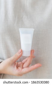 Woman Holding  A Facial Cream Tube