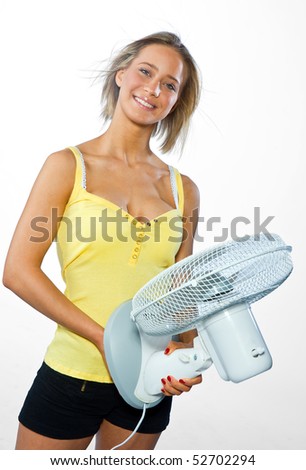woman holding fan and blow hair