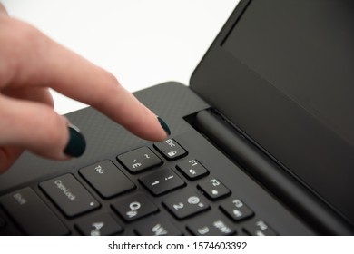 Woman holding finger over ESC button