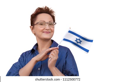 Woman Holding Flag Of Israel. Portrait Of Middle Aged Lady 40 50 Years Old With A National Israeli Flag Isolated On White Background. Learning Hebrew Language. Travel To Israel Concept. Israeli Women