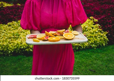 Woman Holding Fruit Tray At The Park