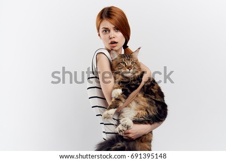 Woman holding a furry cat Maine Coon, allergic to a pet, disease, treatment, depression                               
