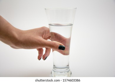 Woman holding a glass of clean water
