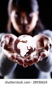 A Woman Holding A Glass Globe Showing Africa. Europe And Middle East