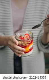 Woman Holding Glass Jar With A Plant Based Dessert. Vegan Yogurt.