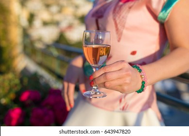 Woman Holding Glass Of Rose Wine