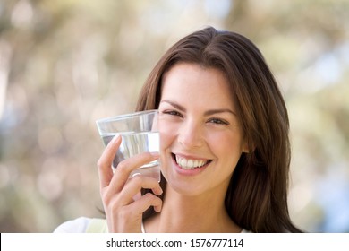 Woman Holding A Glass Of Water