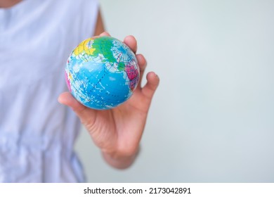 Woman Holding Globe Earth On Green Backgrond.for Eco Care Protect Growth Forest,Environment, Arbor Day, Card For World Earth Day, Conservation Concept.