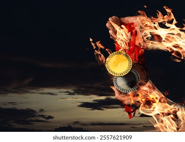 Woman holding gold, silver and bronze medals in her flaming hands against darkened sky, closeup - Powered by Shutterstock