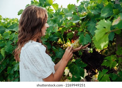 woman holding grapes gardens nature