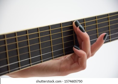 Woman holding hand on guitar tab