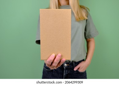 Woman Holding In Hand Small Paper Box. Young Girl With New Package. Postal Service, Delivery. Craft Paper. Gift Box, Present. Box Closeup. Blank Packing, Empty Space. People Communication. Carton Case