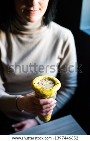Woman holding healthy vegan street food in her hands 
