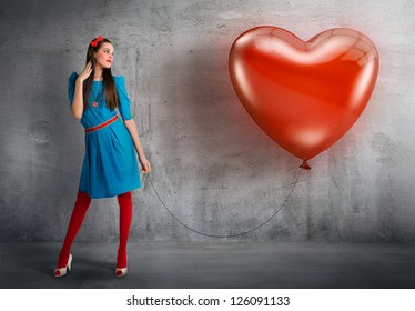 Woman Holding A Heart Shaped Balloon